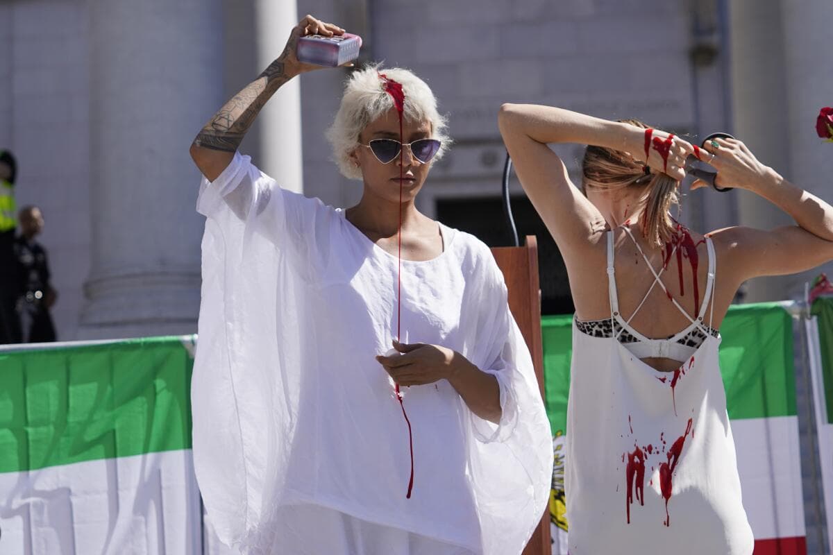 Woman cutting hair in protest